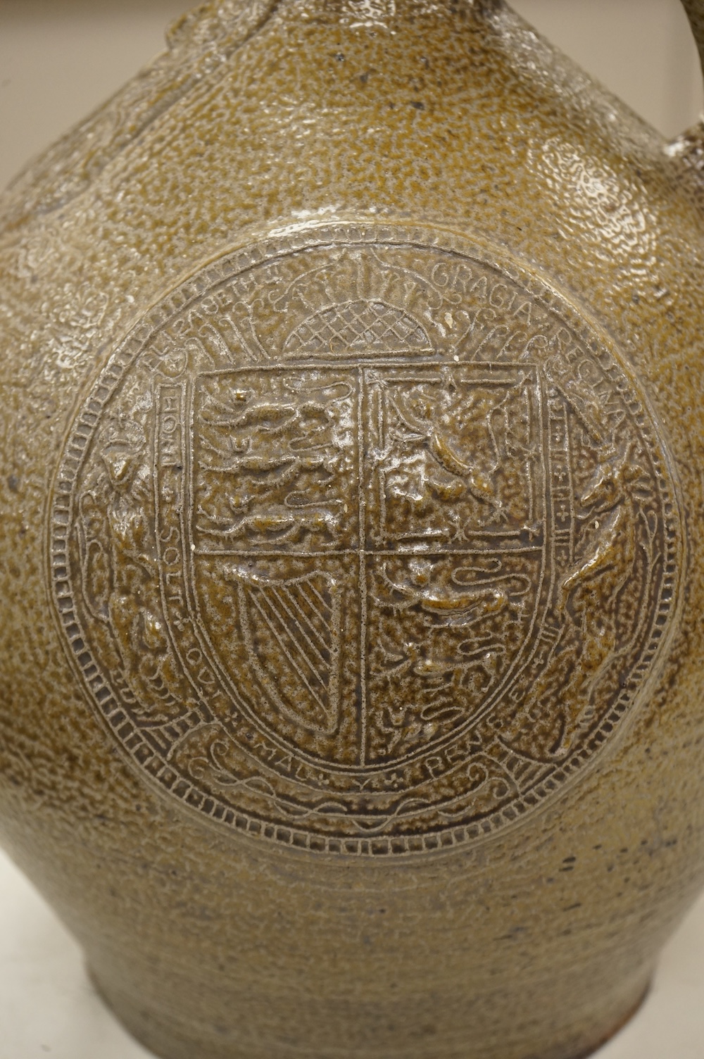 An Elizabeth II coronation commemorative large bellarmine style studio pottery jug, 32cm